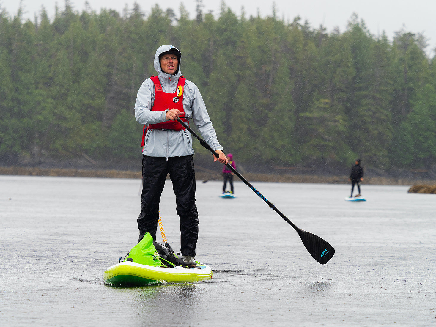 norm hann using a stand up paddle board