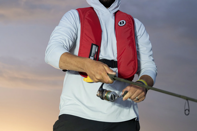Angler wearing an inflatable PFD in a warm climate showing inflatables are a great option if you want a low profile safety option