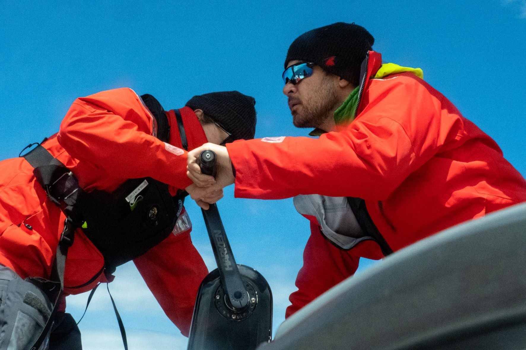 Sailors grinding on their way down the pacific coast in Meris waterproof gear and EP28 hydrostatic life jackets