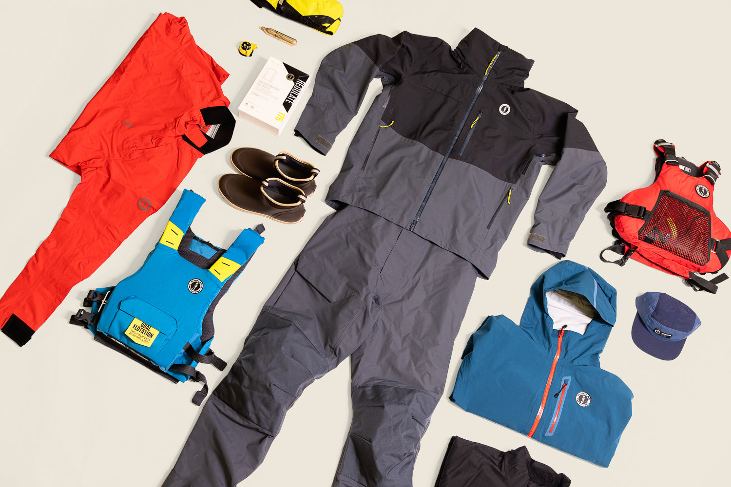 Mustang Survival gear laid out for holiday gifts for men, featuring Meris jacket, PFDs, and Taku waterproof apparel.